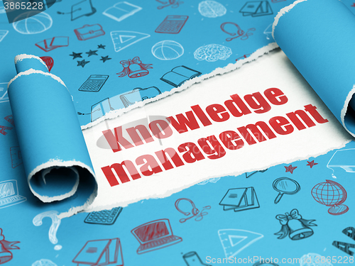 Image of Learning concept: red text Knowledge Management under the piece of  torn paper