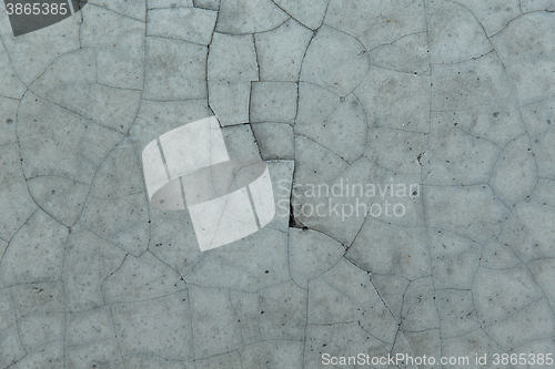 Image of cracked gray concrete wall texture
