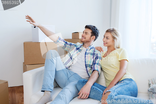 Image of couple with boxes moving to new home and dreaming