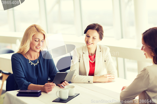 Image of happy women looking at restaurant bill