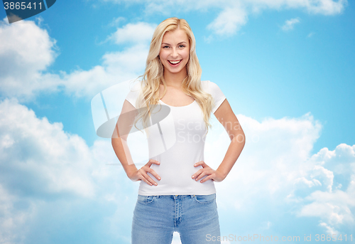 Image of happy young woman or teenage girl in white t-shirt