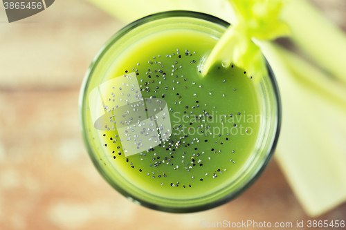 Image of close up of fresh green juice glass and celery