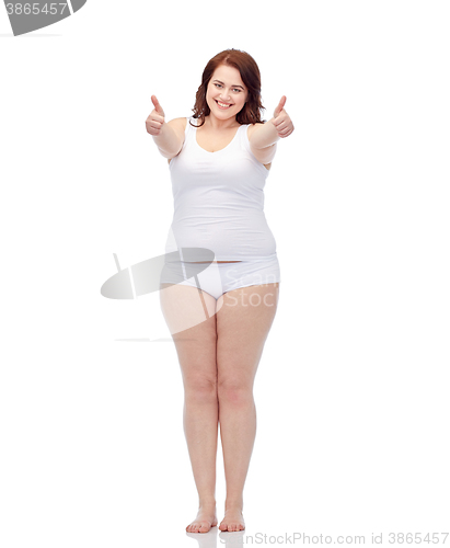 Image of plus size woman in underwear showing thumbs up