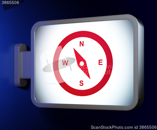 Image of Vacation concept: Compass on billboard background