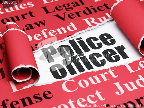 Image of Law concept: black text Police Officer under the piece of  torn paper