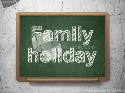 Image of Travel concept: Family Holiday on chalkboard background