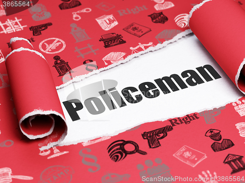 Image of Law concept: black text Policeman under the piece of  torn paper