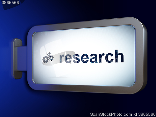 Image of Marketing concept: Research and Gears on billboard background
