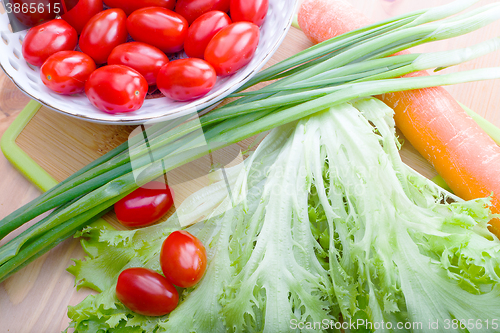 Image of vegetables on a wooden background