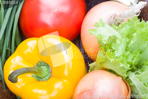 Image of vegetables on a wooden background