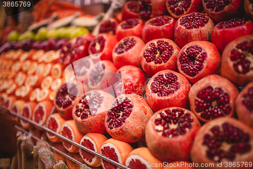 Image of Colourful picture of pomegranates on the market