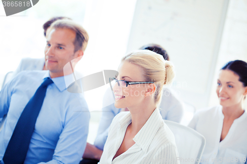 Image of businessmen and businesswomen on conference