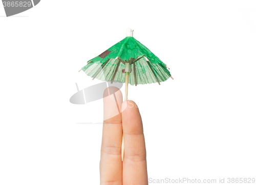 Image of close up of two fingers with cocktail umbrella