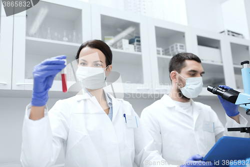 Image of young scientists making test or research in lab