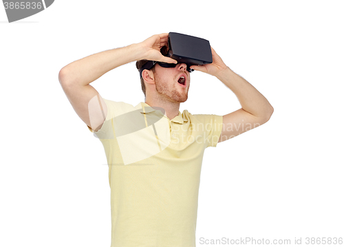 Image of happy man in virtual reality headset or 3d glasses