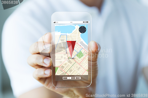 Image of close up of male hand showing map on smartphone
