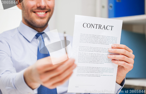 Image of close up of businessman holding contract document