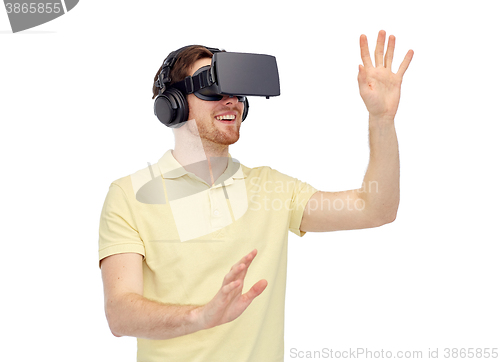 Image of happy man in virtual reality headset or 3d glasses