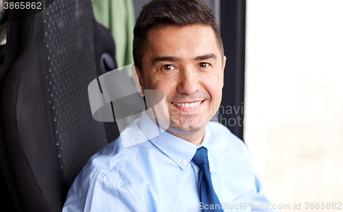 Image of close up of happy bus driver or businessman