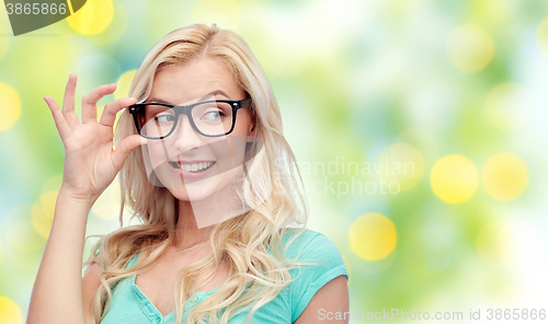 Image of happy young woman or teenage girl in glasses