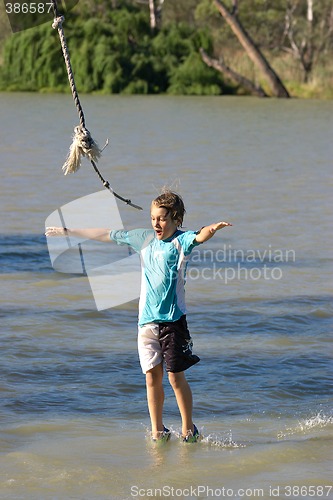 Image of boy walking on water