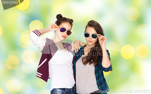 Image of happy smiling pretty teenage girls in sunglasses