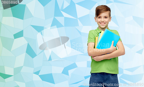 Image of happy student boy with folders and notebooks