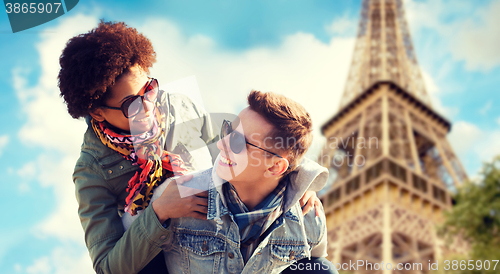 Image of happy teenage couple over paris eiffel tower