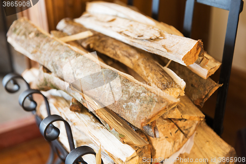 Image of close up of firewood stack on stand at home