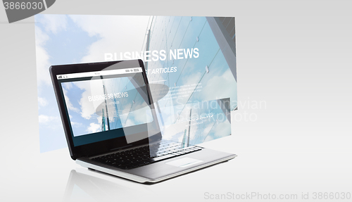 Image of laptop computer with business news on screen