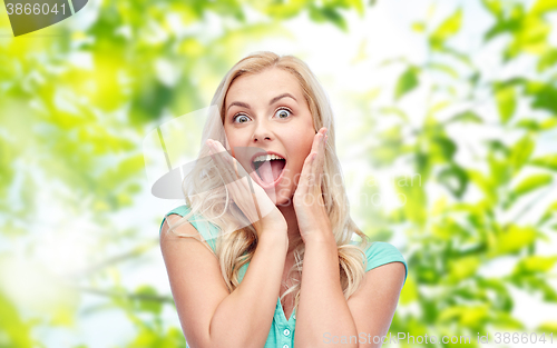 Image of surprised smiling young woman or teenage girl