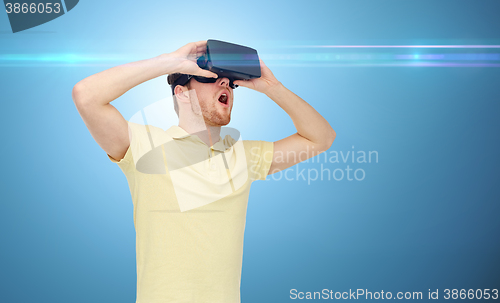 Image of happy man in virtual reality headset or 3d glasses