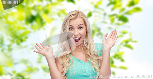 Image of surprised smiling young woman or teenage girl