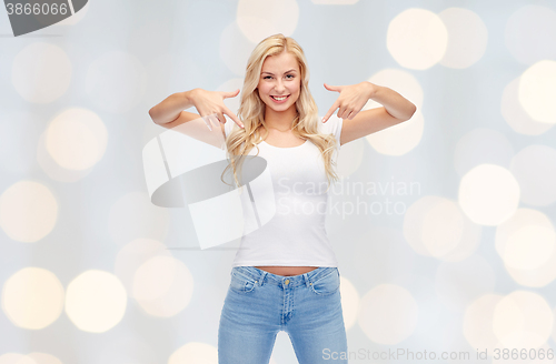 Image of happy young woman or teenage girl in white t-shirt