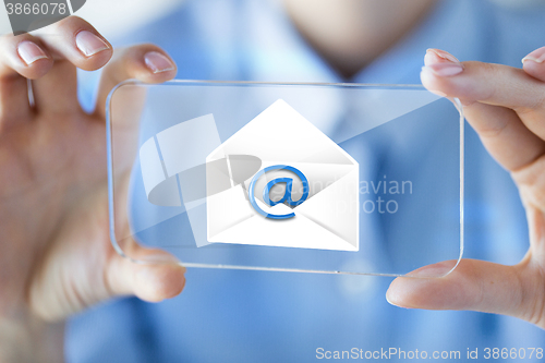 Image of close up of woman with transparent smartphone