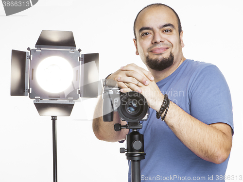 Image of professional photographer with photographic equipment