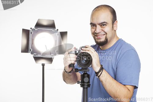 Image of professional photographer with photographic equipment