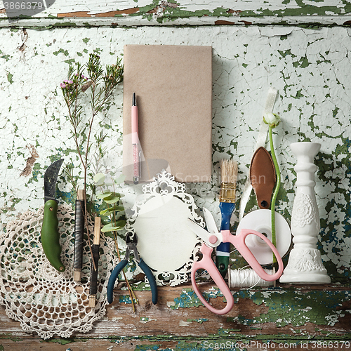 Image of The florist desktop with working tools and ribbons