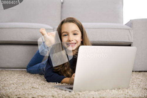 Image of Little girl working with a laptop