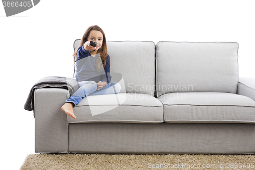 Image of Girl holding a TV remote