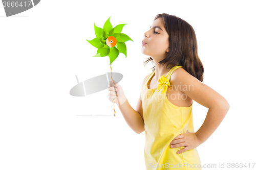 Image of Girl blowing a windmill