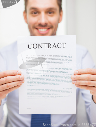 Image of close up of businessman holding contract document