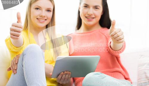 Image of close up of young women with tablet pc at home