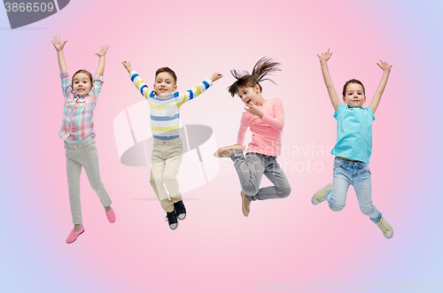 Image of happy little children jumping in air