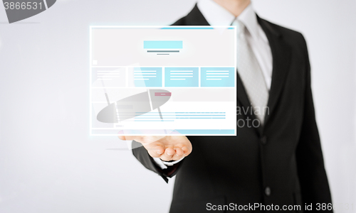 Image of close up of businessman showing web page design