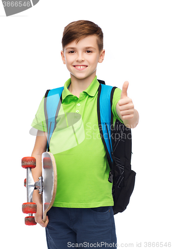 Image of boy with backpack and skateboard showing thumbs up