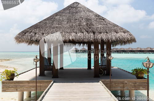 Image of patio or terrace with canopy on beach sea shore