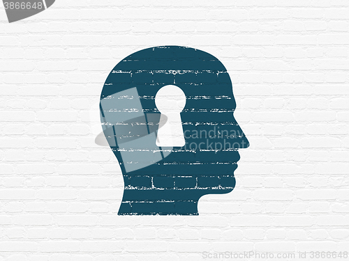 Image of Finance concept: Head With Keyhole on wall background
