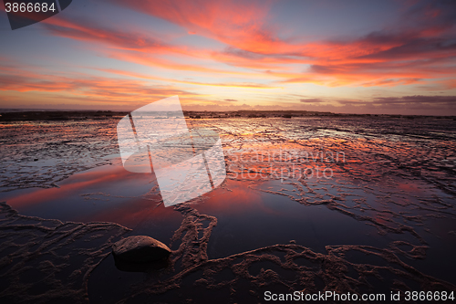 Image of Sunrise over Long Reef at low tide with reflectins