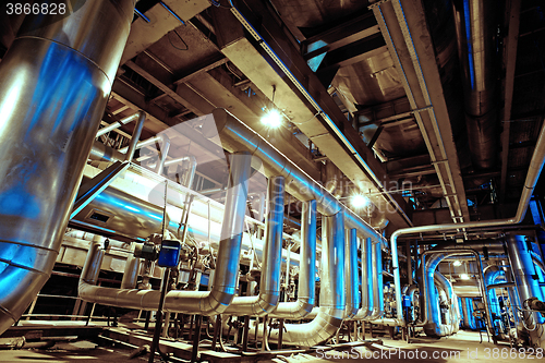 Image of Equipment, cables and piping as found inside of a modern industr